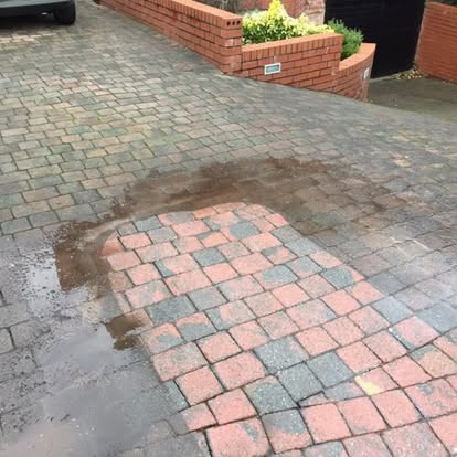 Driveway cleaning in progress by Total Gleam